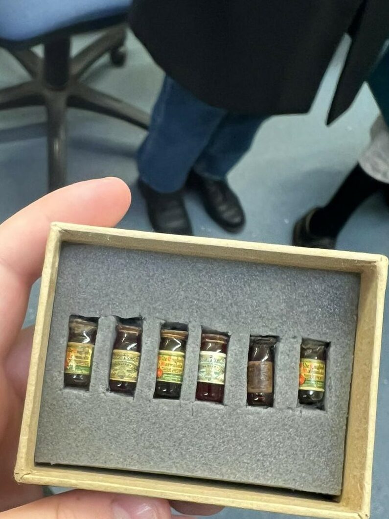 6 miniature jam jars in a cushioned box